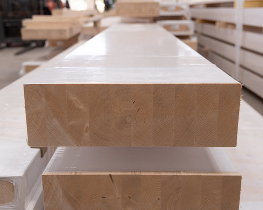 glulam beams lying down in a factory