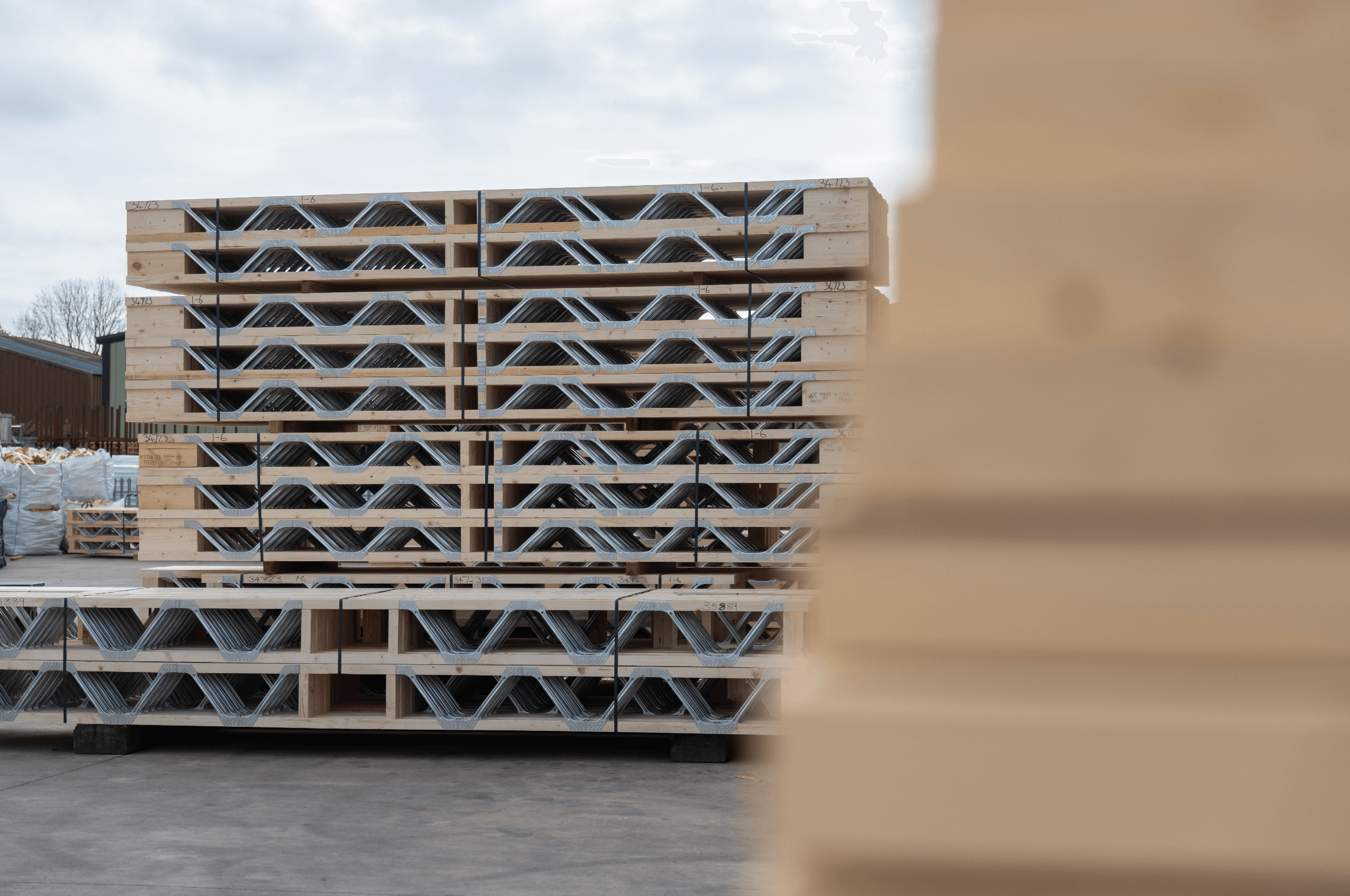 posi-joists on the back of a lorry with timber in the foreground