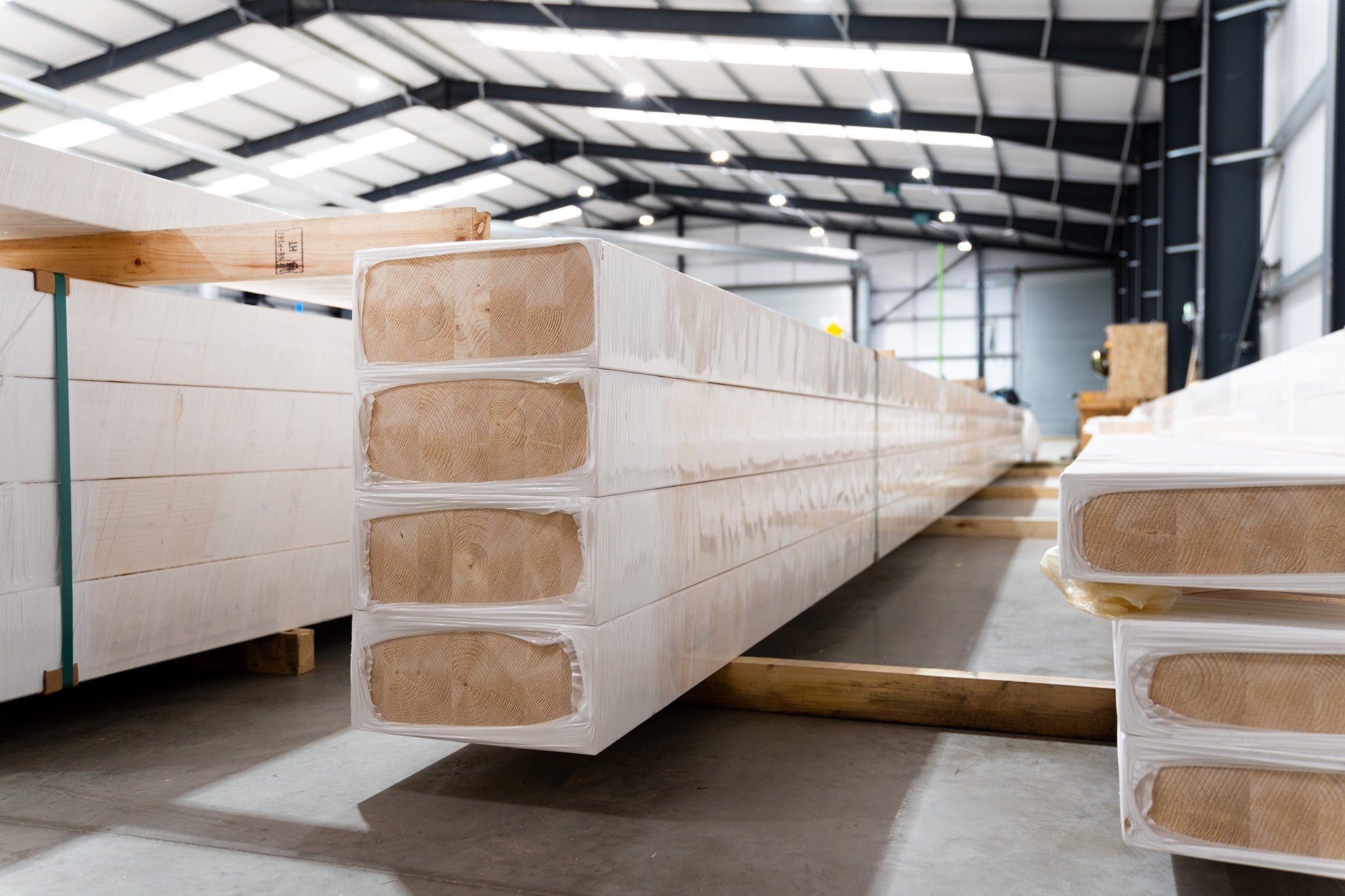 glulam beams stacked in a factory