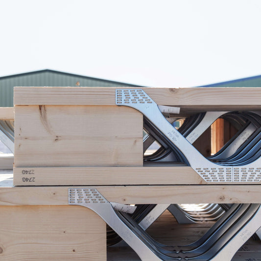 close up of posi-joists stacked in a yard