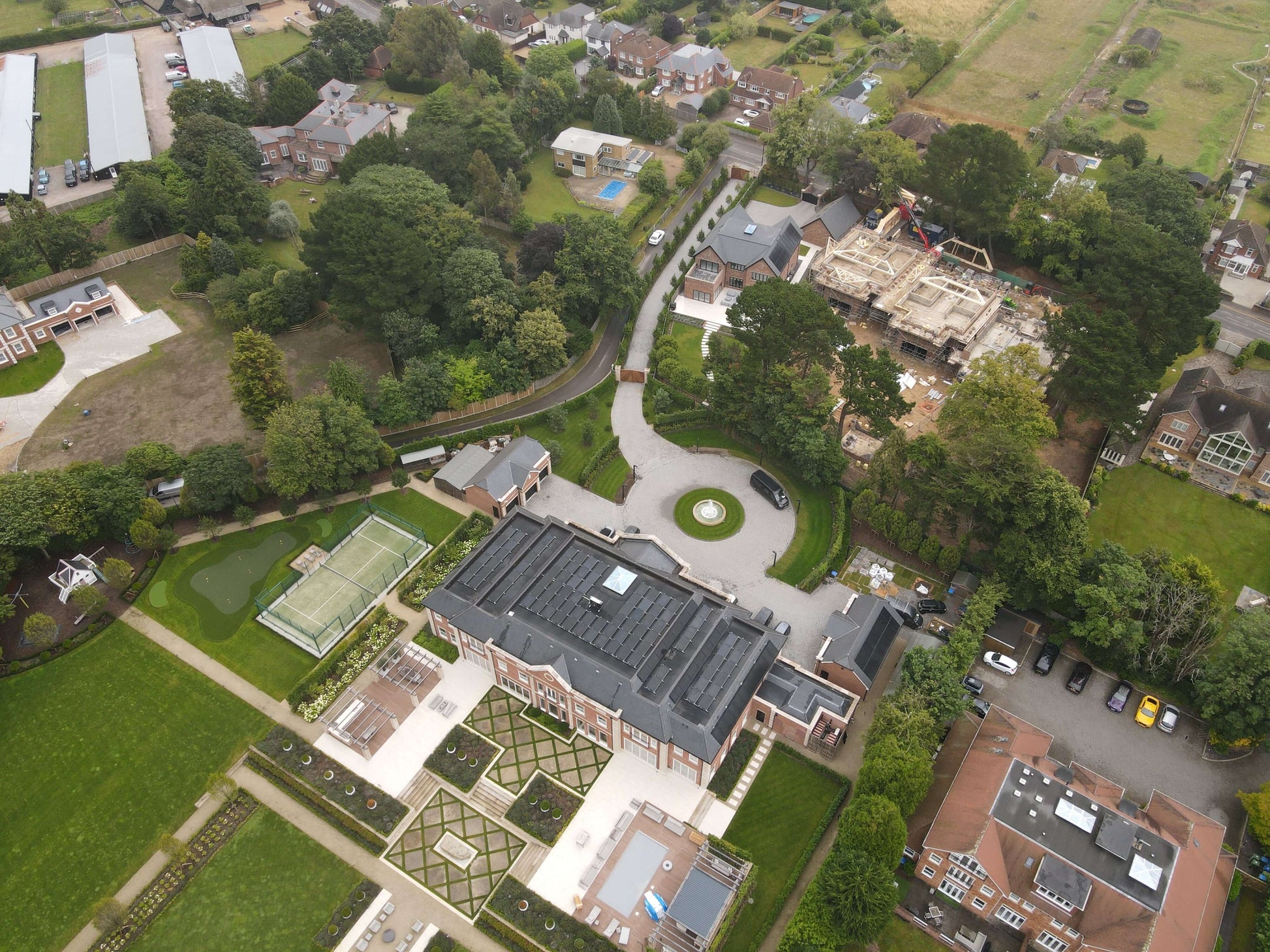 birds eye view of a building site with attic trusses being delivered