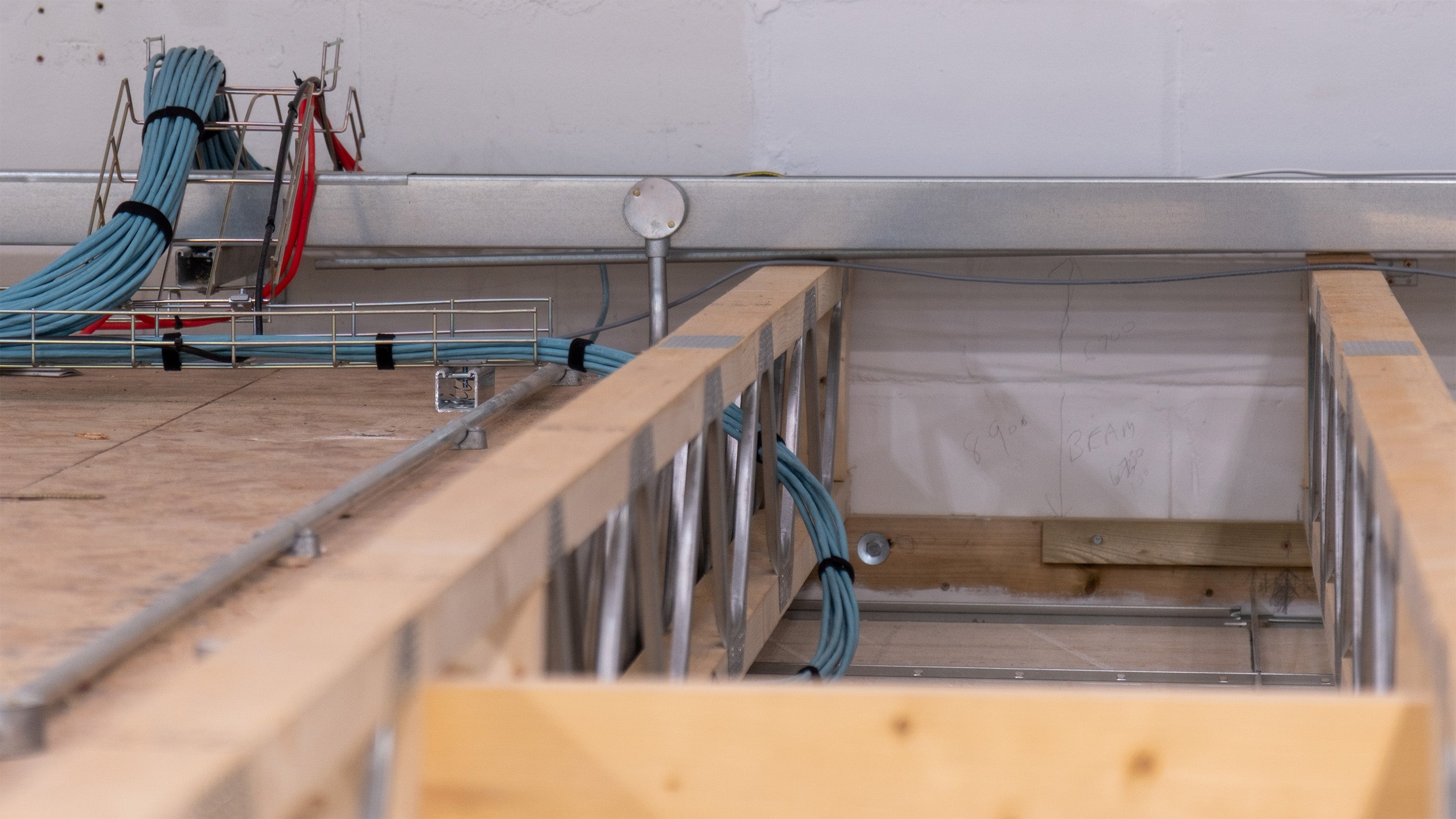 posi-joists installed in a warehouse in worcestershire with electrical wires running through the open webs. 