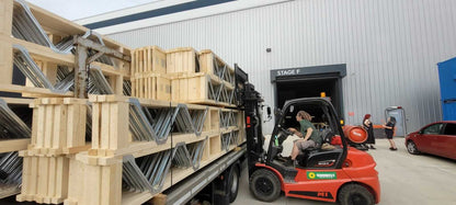 posi-joists being unloaded from a lorry with a forklift