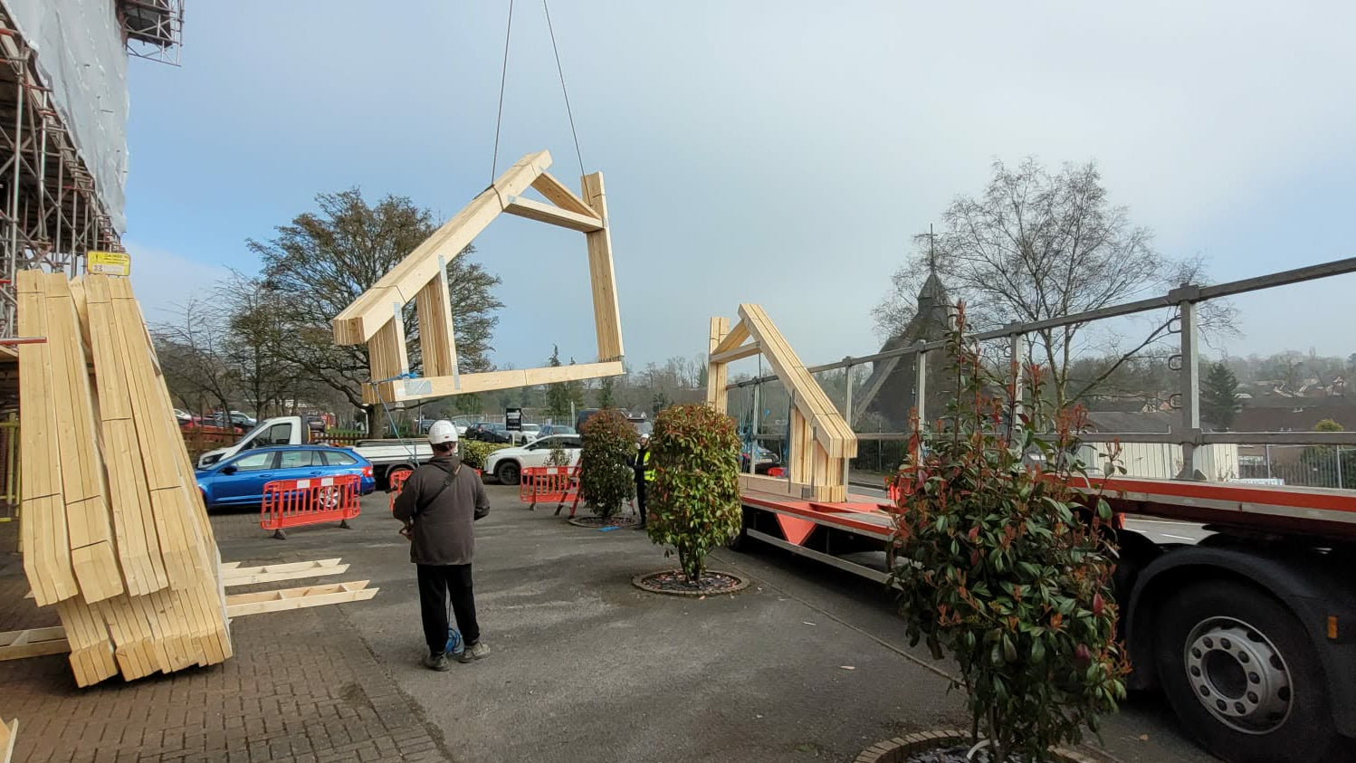 mono trusses being delivered to a building site