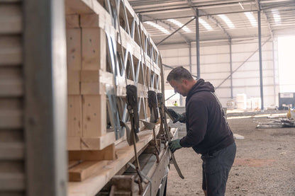 man unloading posi-joists from a lorry in worcestershire